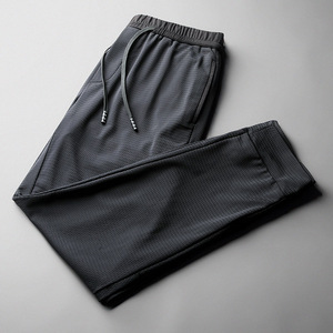 男士网眼裤子男夏季薄款冰丝束脚九分休闲裤中年宽松跑步运动裤男