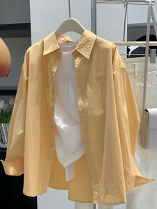 今年流行爆款韩系上衣女秋季新款气质简约休闲橘黄色翻领长袖衬衫