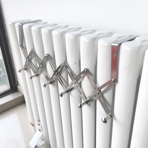 不锈钢暖气片挂钩晾衣架电暖气置物架子换热器取暖器毛巾架毛巾杆