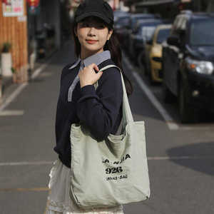 韩版百搭字母帆布包包女软面大容量单间斜挎包简约百搭通勤