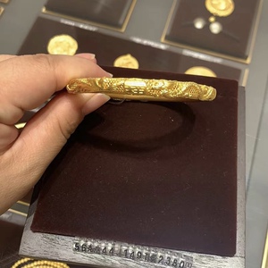 周大福足金黄金传承系列龙凤手镯福镯镂空雕花可转动精品礼物