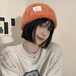橙色短发带的帽子戴的冬女适合短发的今年流行的冬天漂亮毛线帽酷