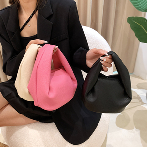软皮粉色包包手提独特小众包包斜挎2022新款百搭设计感单肩水桶包