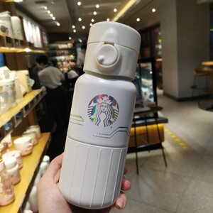 00tb998616447淘宝星巴克杯子2021环保未来太空宇航员小熊款带银色