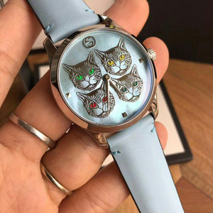 正品gucci 古奇贝母盘创意猫头浅蓝表带石英女表 ya1264124
