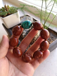 橄榄核核雕,七星罗汉,整套带绿松石一起出.作者沈锦