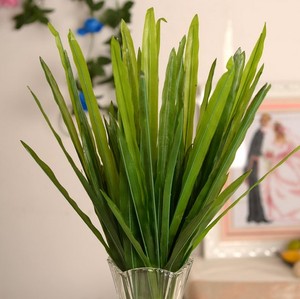 淘宝 仿真绿植假花塑料花单只兰花盆栽植物背景墙装饰花草剑兰叶 