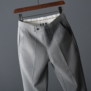 男装平铺挂拍摄影 黑灰底商务休闲裤西裤挂拍 创意造型挂拍摄影