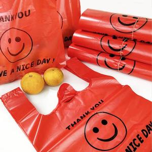 加厚红色笑脸塑料袋食品袋大小号超市购物笑脸袋外卖打包装手提背