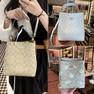 coach/蔻驰女士包袋新款复古印花马车爱心水桶包单肩斜跨手提包潮