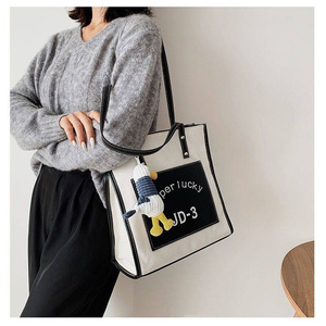 斜背两用帆布包