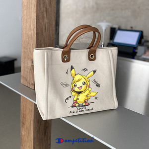宝可梦皮卡丘比卡丘联名帆布包女新款单肩大容量水桶包手提托特包