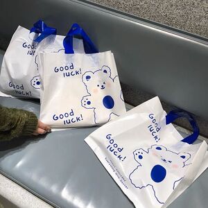 可爱毛线熊塑料购物包装童装女装服装店手提袋好看装衣服袋子定制