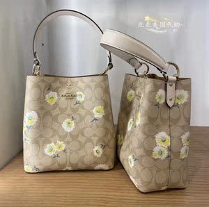 美国蔻驰coach女包经典马车印花爱心水桶包单肩斜挎流浪包小雏菊