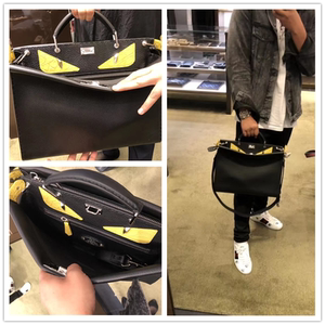 代购  男士新款  经典 peekaboo 小怪兽 恶魔铆钉眼睛公文包男包