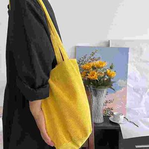 新秋冬款亮黄色灯芯绒圆筒单肩包女韩版小众设计大容量立体水桶包
