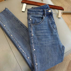 2022年春季高级感重工铆钉修身高腰提臀显瘦百搭牛仔裤钉珠小脚裤