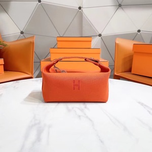 靠谱家—正品hermes/爱马仕帆布橘色hobo女士手拎饭盒包 洗漱包男