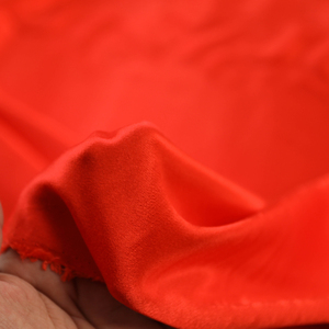 意大利进口橘红色垂顺柔软人皱缎面肌理天丝棉面料设计师服装布料