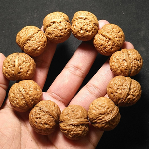 云南野生金蟾元宝铁核桃手串手持,秒沉水,矮桩平底,皮质硬度高