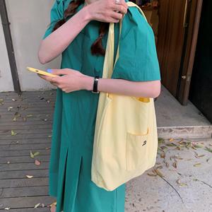 韩国小众帆布袋夏天新款鹅黄色大容量购物袋奶黄色帆布包女单肩包