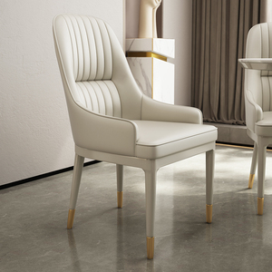奶油风轻奢高级餐椅家用定制真皮全白色艺术设计师舒适硅胶皮椅子