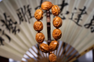 孙建忠 核雕大师 瑞兽罗汉 2.35*2.7 双面全身雕 橄榄核手串 油核