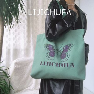 美式灰绿色蝴蝶托特帆布包大容量小众购物袋设计师布包上班通勤