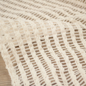 米白色透明镂空编织网格时尚布料 弹力很柔软有垂感 外搭开衫面料