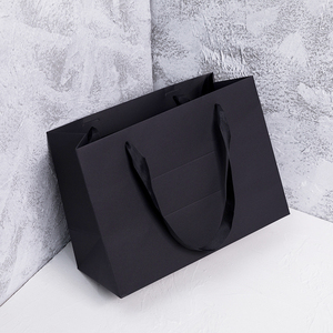 服装店手提袋高档纸袋定制包装衣服礼品黑色纸盒口袋简Z约高端结