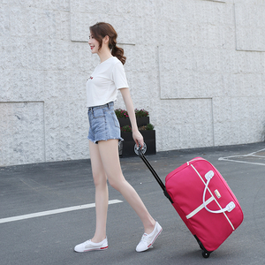 新款多花色拉杆包旅行包女手提韩版短途衣服简约行李袋学生男轻便