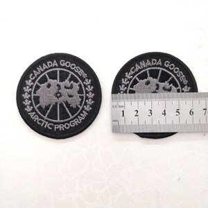 加拿大鹅标志logo章臂刺绣潮国产羽绒服外套圆手工2022新款