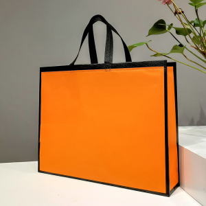 新款橘橙色墨绿金边覆膜无纺布手提袋简约大气袋子男女v装定制log