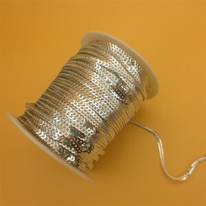 新mm圆形dpvc亮片条连线亮片15个颜色现货diy服装辅料亮片带1卷90