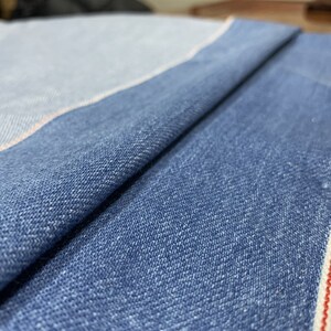 水洗做旧牛仔布料l浅蓝色丹宁牛仔面料工装外套服装童装冈山牛仔
