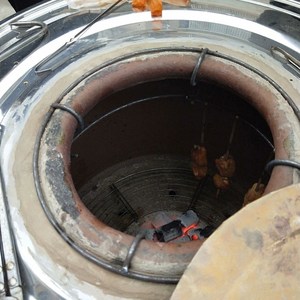 新疆烤包子馕坑烤肉炉烤鸡腿烤猪蹄羊肉串木炭燃气烤鸭炉摆摊商用