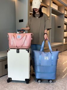 外交官带万向轮的行李包女大容量手提行李收纳袋旅行包可折叠行李