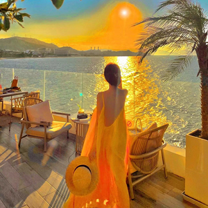 度假风性感露背三亚海边吊带裙慵懒长款超仙宽松显瘦沙滩连衣裙女