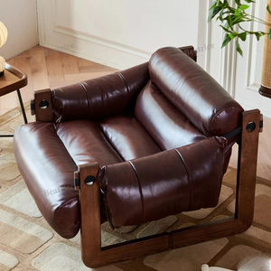 北欧单人沙发椅中古风实木复古设计师款家用休闲卧室真皮泽西岛椅