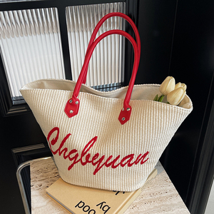 泰国字母刺绣草编包包女休闲度假沙滩编织包旅行手提菜篮子水桶包