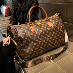香港品牌旅行包大容量女2024新款春夏真皮手提大包短途男士行李包