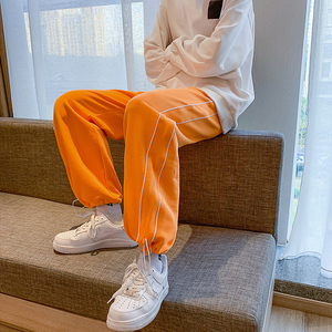 橙色裤子男宽松
