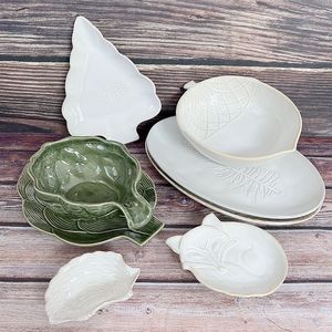 外贸尾单异形陶瓷餐具家用米白色椭圆型鱼盘复古浮雕水果盘零食碗
