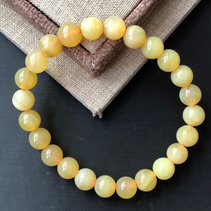 12/325天然黄欧泊手链 7.7毫米左右 12.3克 价格25元一条