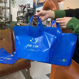 [厂家低价促销]新款网红克因蓝笑脸塑料袋服装店手提袋衣服塑料