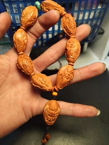 橄榄核九龙关公,红皮油核,老油核精雕工,雕工精细,品相完美
