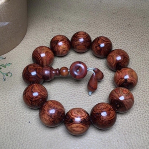 鬼脸纹海南黄花梨20mm海黄鬼眼佛珠手串,本店佛珠手串,仙游