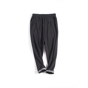 新款春季脚口字母收边八分抽绳休闲哈伦裤棉质萝卜裤卫裤女款裤子