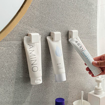 Toothpaste Shelving-free wall-mounted Wall-mounted Toothpaste Thever Wash Face Milk Clip Bathroom Toilet Wall Containing