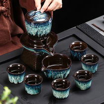 A complete set of semi-automatic purple sand stone grinding kung fu tea set lazy anti-hot tea maker household